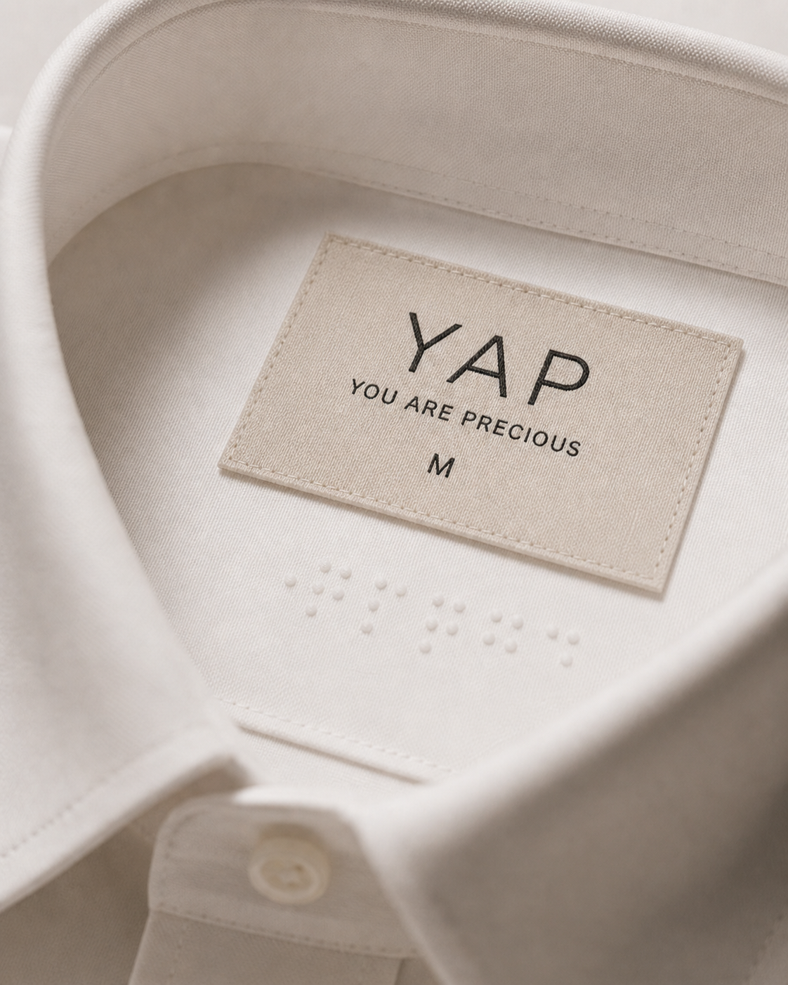 Yap shirt label with braille detail